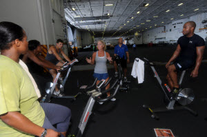 Morale, welfare and recreation fitness specialist Susan M. Lowry instructs Sailors aboard the aircraft carrier USS Carl Vinson (CVN 70) on group cycling. Image from http://commons.wikimedia.org