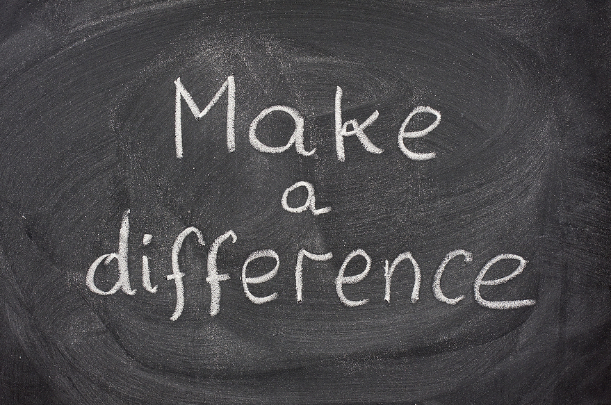 make a difference motivational phrase handwritten with white chalk on blackboard